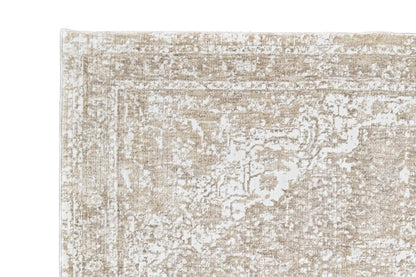 Beige and white patterned rug on a black background